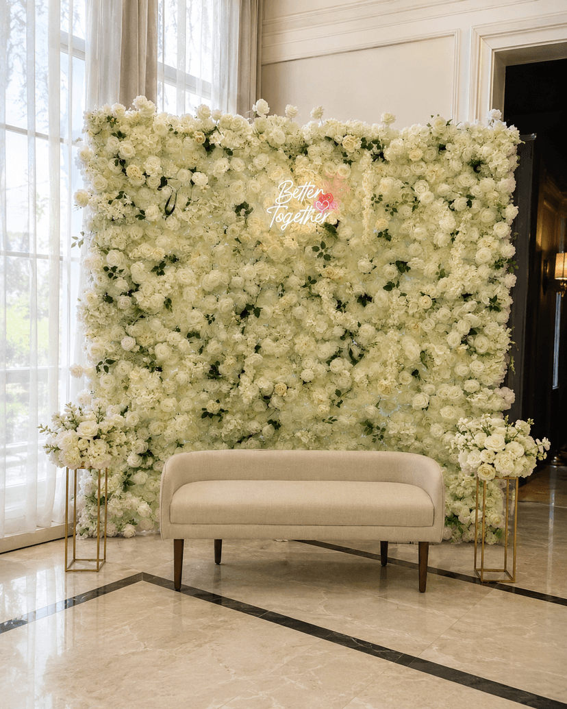 Flower wall with baby shower sign